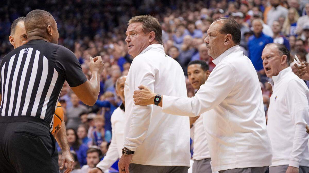 Kansas Jayhawks assistant coach Kurtis Townsend holds back head coach Bill Self during a game against the Texas Longhorns at Allen Fieldhouse on Feb. 6, 2023.