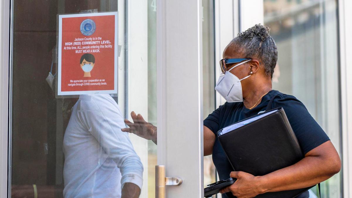 Visitors to the Jackson County Courthouse in downtown Kansas City wore masks as they entered the building Monday, July 18, 2022.