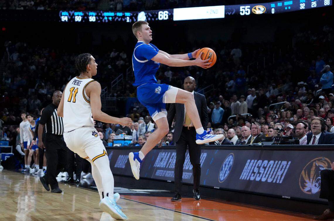 Drake Bulldogs guard Bennett Stirtz (14) saves a ball from going out of bounds against Missouri Tigers guard Trent Pierce (11) during a first round men’s NCAA Tournament game at Intrust Bank Arena on March 20, 2025.