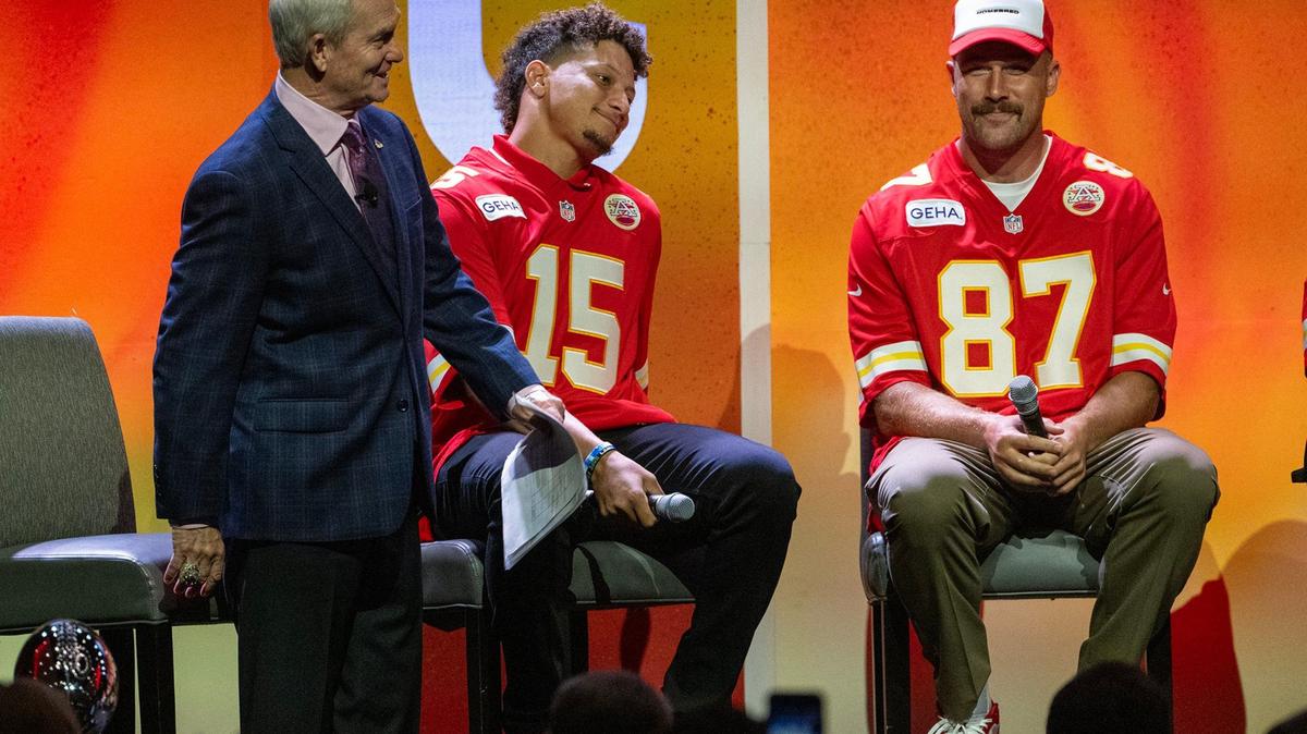 Chiefs announcer Mitch Holthus, from left, Kansas City Chiefs quarterback Patrick Mahomes (15) and tight end Travis Kelce (87), sit on stage during the 2024 Chiefs Kickoff Luncheon on Wednesday, August 28 at the Loews Kansas City Hotel.