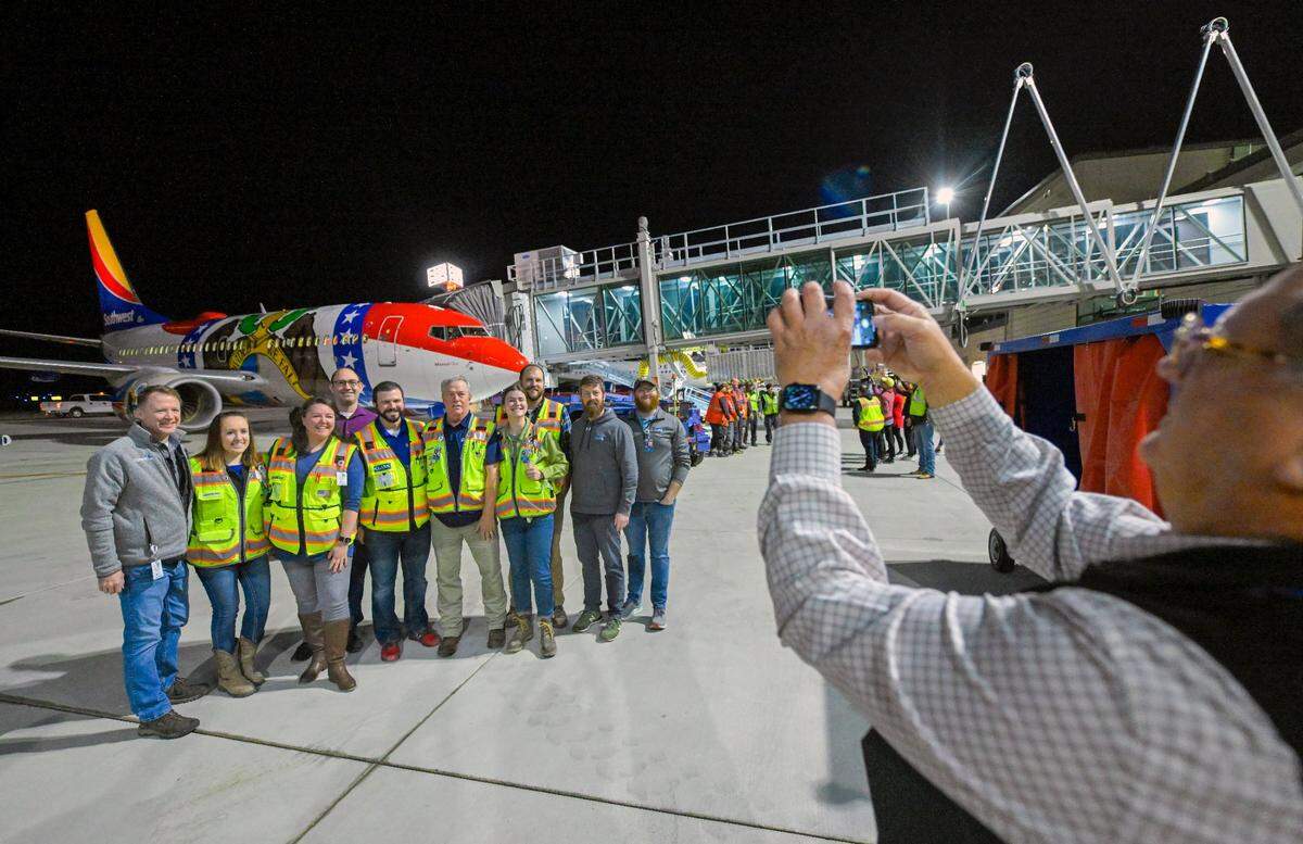 Crews from Edgemoor and Clarkson Construction Company had a photo taken in front of Southwest Airlines plane dubbed Missouri One, the first flight out of the new $1.5 billion single terminal at Kansas City International Airport opened to travelers Tuesday, Feb. 28, 2023. The flight headed to Chicago.