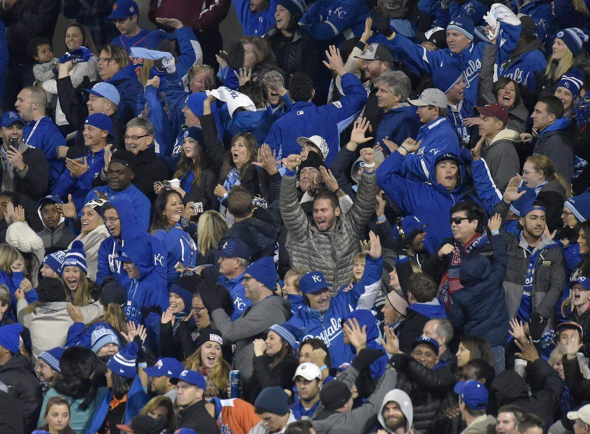 A group of Kansas City Royals fans celebrated after second baseman Ben Zobrist on a single hit by first baseman Eric Hosmer in the eighth inning during Game 4 of the World Series on Saturday, October 31, 2015 at Citi Field in New York.