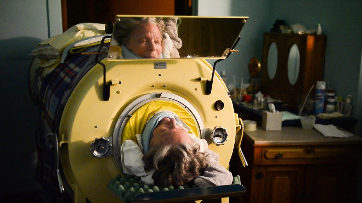 Getting into the iron lung takes more than an hour.