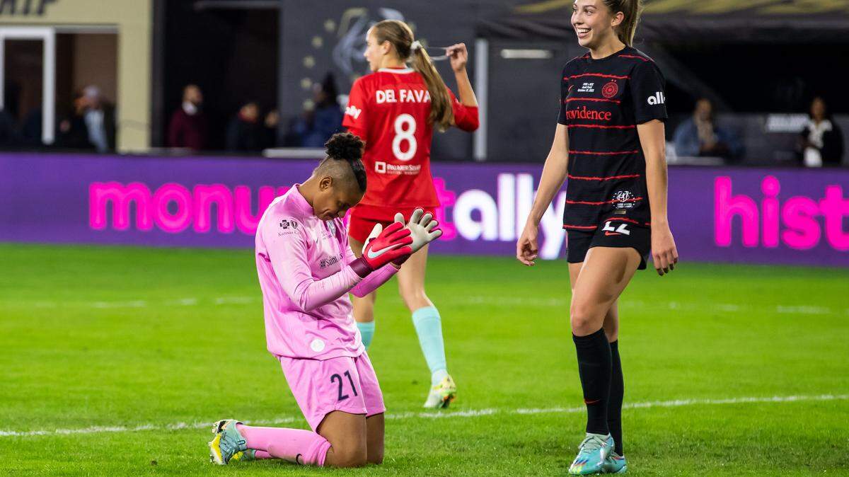 Portland Thorns forward Morgan Weaver, right, walks past stunned KC Current goalkeeper AD Franch after an own-goal on Kansas City during the second half of Saturday night’s NWSL championship game at Audi Field in Washington D.C.