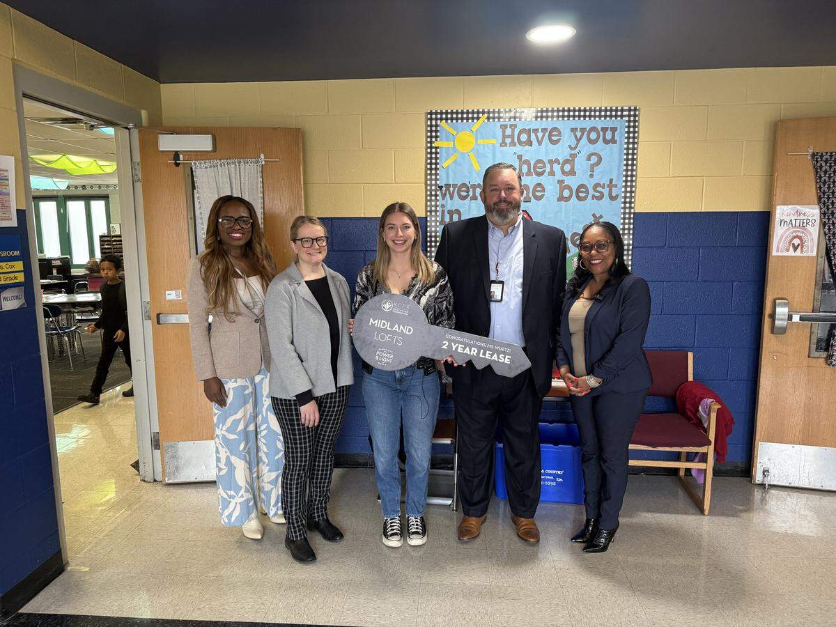 Brooke Wurtz (middle) was awarded a free two-year lease, thanks to a partnership between Kansas City Public Schools and the Kansas City Power & Light District on Nov. 20 at Faxon Elementary.