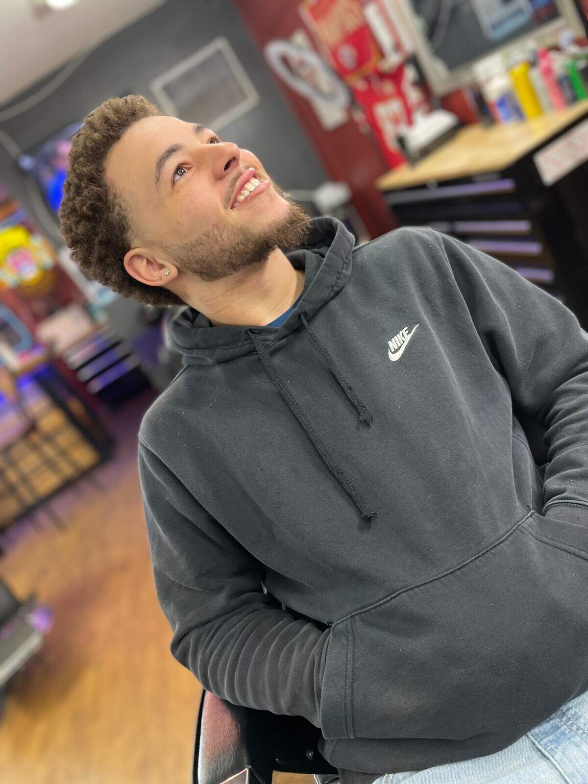 Thomas Lewis, 20, was a role model to his son and nephews, his family said. Lewis was found dead Monday following a shooting in Kansas City.