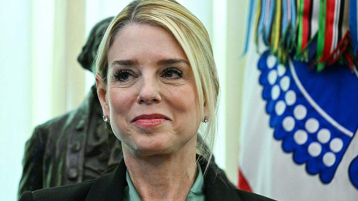 US Attorney General Pam Bondi listens as US President Donald Trump (out of frame) speaks before swearing in the new Secretary of Homeland Security Markwayne Mullin in the Oval Office of the White House in Washington, DC, on March 24, 2026. The US Senate on Monday confirmed Mullin as the new chief of the Department of Homeland Security (DHS), the agency reeling from a partial government shutdown as it works to enforce President Donald Trump's immigration crackdown. (Photo by Jim WATSON / AFP via Getty Images)
