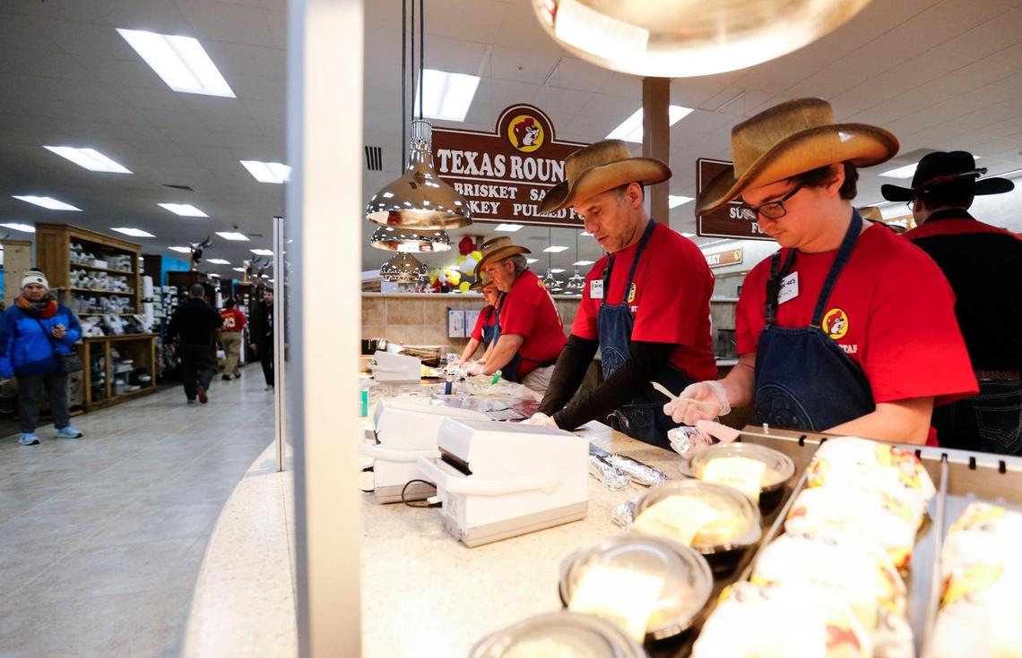 Buc-ee’s barbecue crew preparing breakfast brisket tacos.