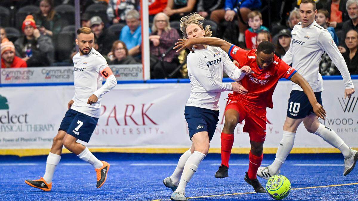 Kansas City Comets player Lesia Thetsane, second from right, fights off a Tacoma Stars defender during a recent match at Cable Dahmer Arena.