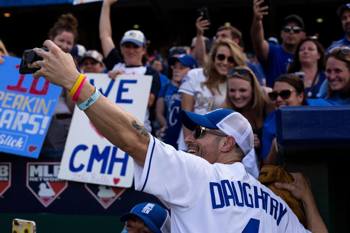 “American Idol” alum Chris Daughtry takes a selfie with fans after the Big Slick Celebrity Softball game Friday at Kauffman Stadium. Last year, Daughtry sang at the Big Slick auction, and might do the same on Saturday.