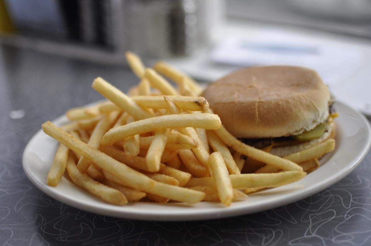Single cheeseburger with fries at Town Topic.