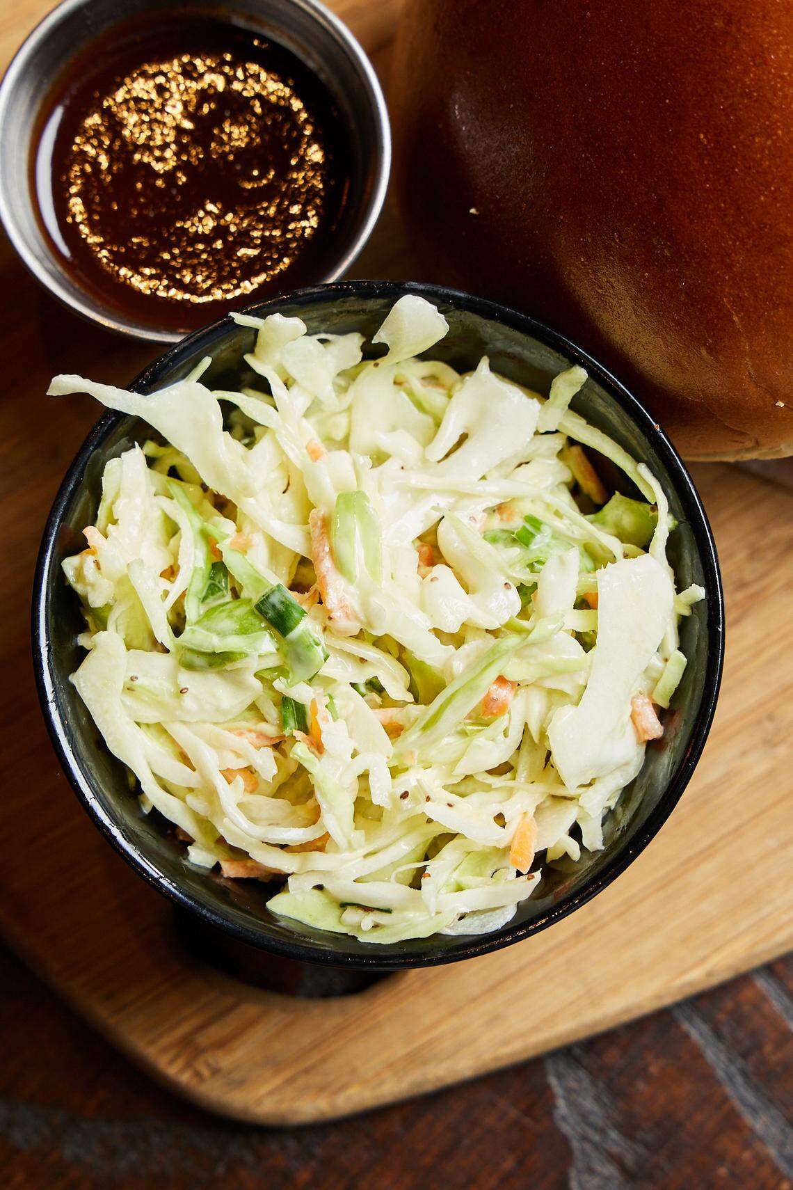 Q39’s apple slaw with creamy dressing and green onions.