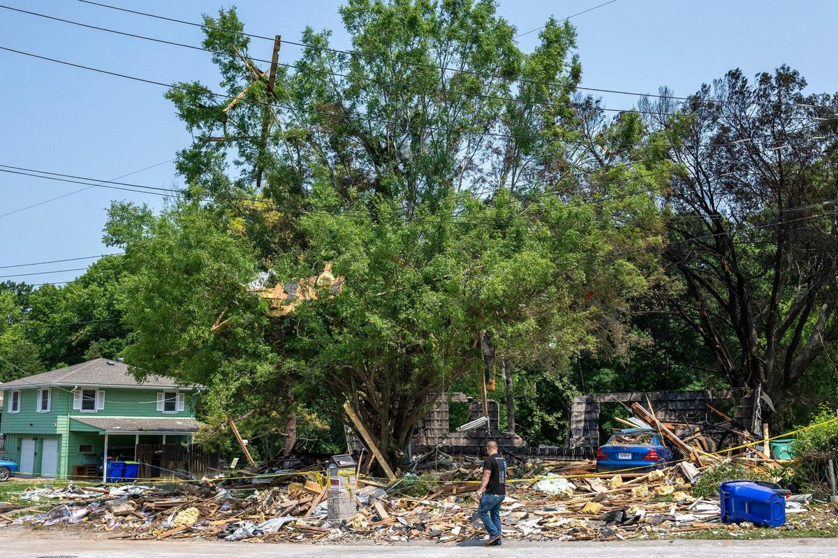 Debris is seen scattered across the site of a home explosion on Sunday, June 1, 2025, in Gladstone. The blast the day before killed one person and damaged nearby homes.