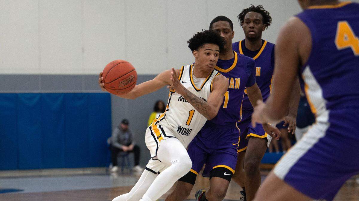 Archbishop Wood junior Jalil Bethea drives past a Roman Catholic player during the PIAA Class 6A semifinal game at Bensalem High School on Tuesday, March 21, 2023.