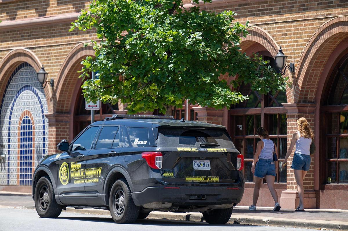 Private security officers from Metro Public Safety sit in the car at the Country Club Plaza on Wednesday, July 9, 2025 in Kansas City.