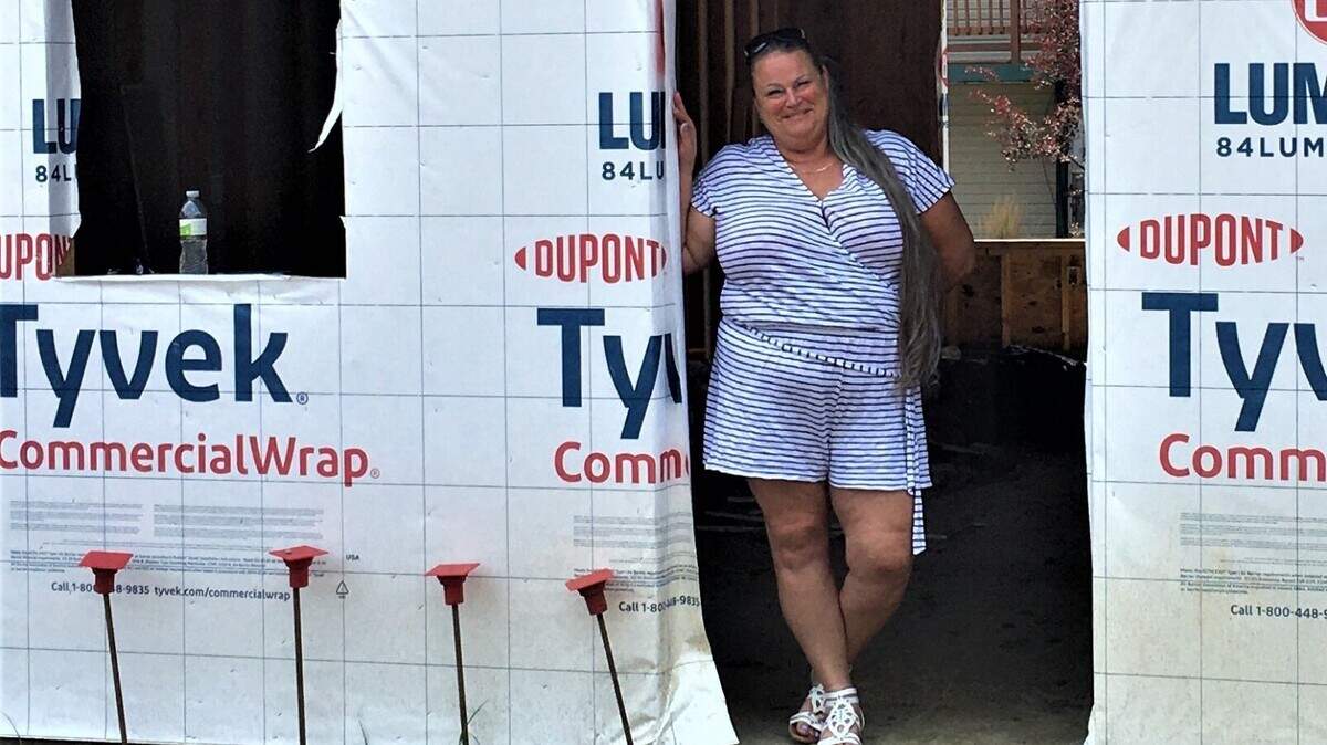 Kalena Smith stands inside a new building at 505 S.W. Mission Road in Lee’s Summit. The fourplex is being built on the campus of Hillcrest Transitional Housing to replace the one that burned down in July of 2020. Smith and her family were living in the building at the time.