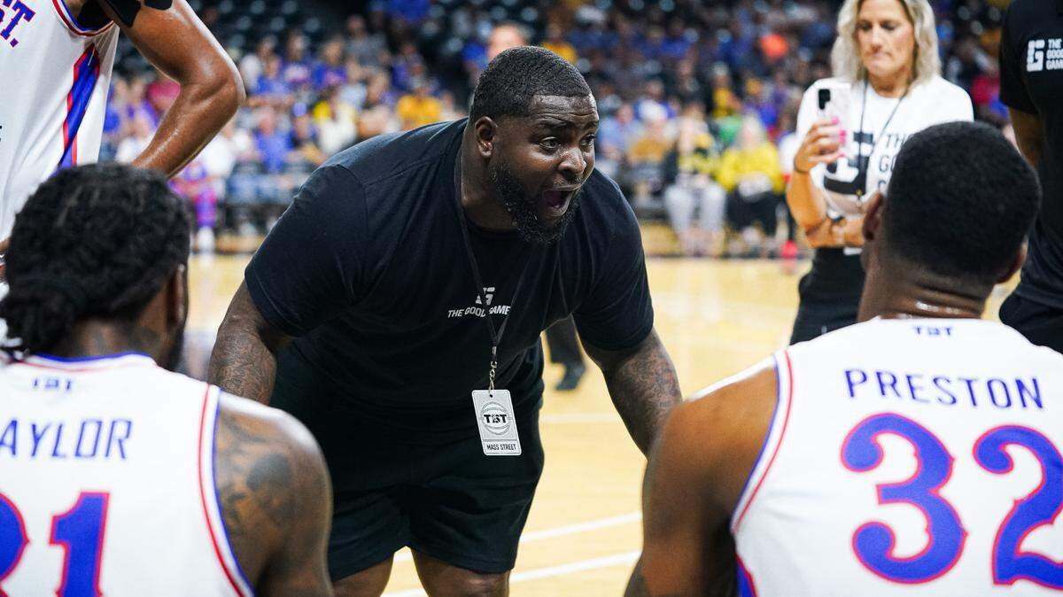 Mass Street TBT coach Sherron Collins, a former KU point guard, speaks to his team during a timeout at Monday’s game against Florida TNT in Wichita.