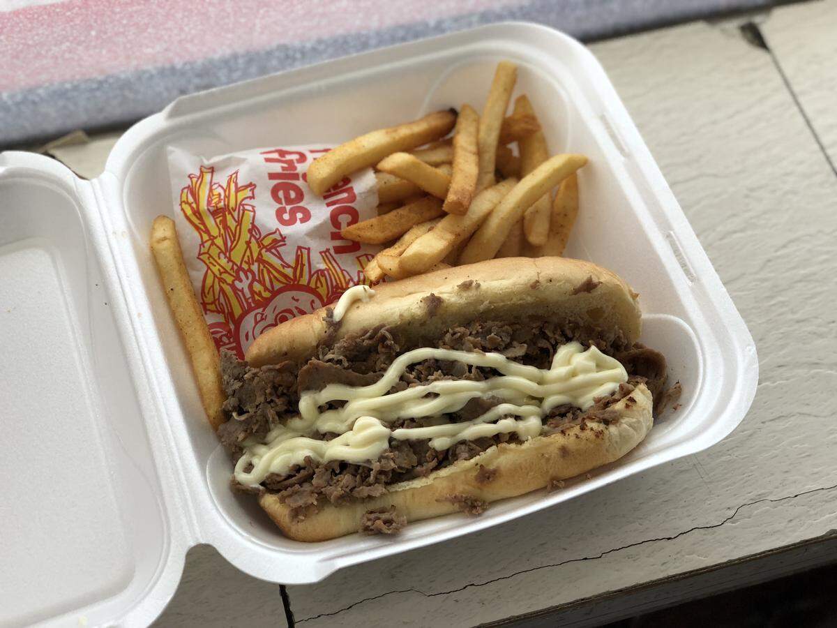 Steak'M Take'M's classic cheesesteak combo ($8.25) comes with a steak cheesesteak sandwich with the customer's choice of sauce (mayo is the favorite) and seasoned fries.