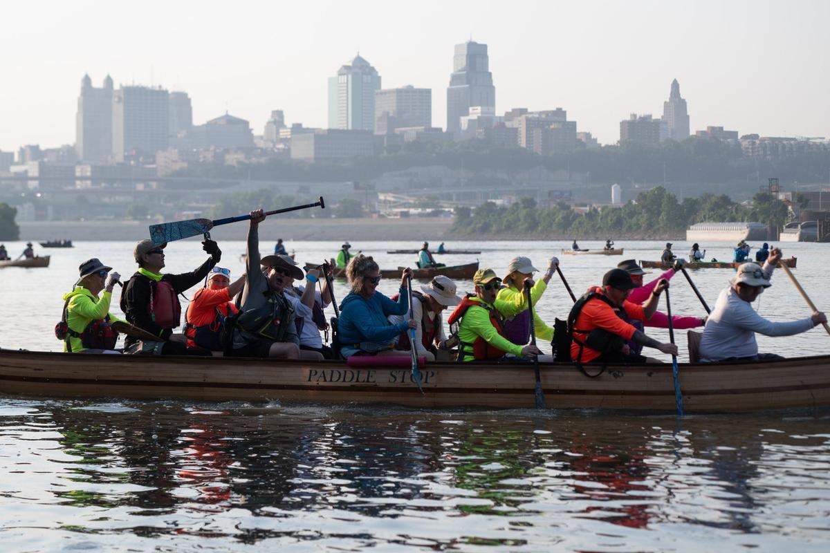 The Paddle Stop New Haven team paddles their 14-person canoe into position to begin the MR340 river race.