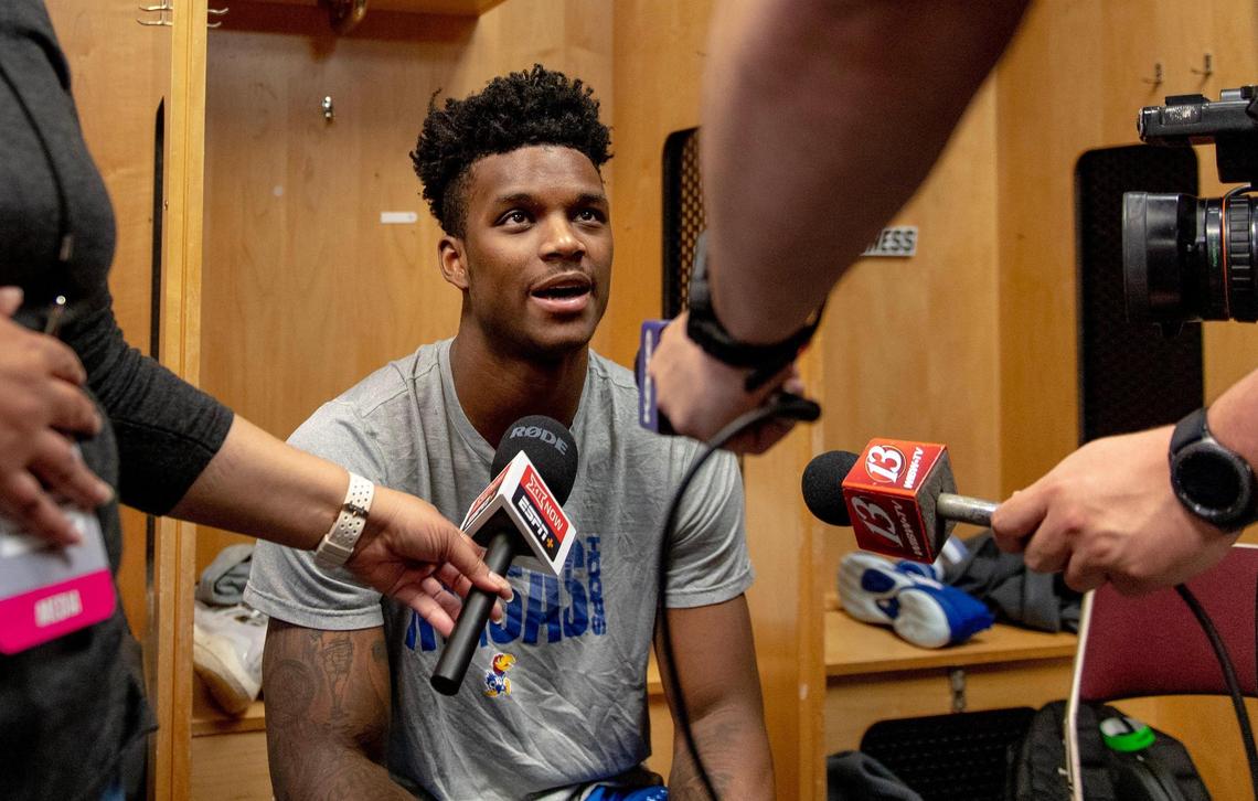 Kansas forward K.J. Adams Jr. speaks with the media in the locker room Wednesday in Des Moines.