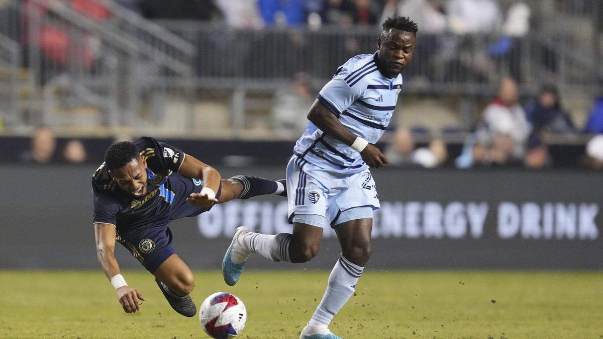 Sporting Kansas City forward Willy Agada (right) battles with Philadelphia Union midfielder Jose Andres Martinez in the first half at Subaru Park in Chester, Pennsylvania on Saturday, April 1, 2023.