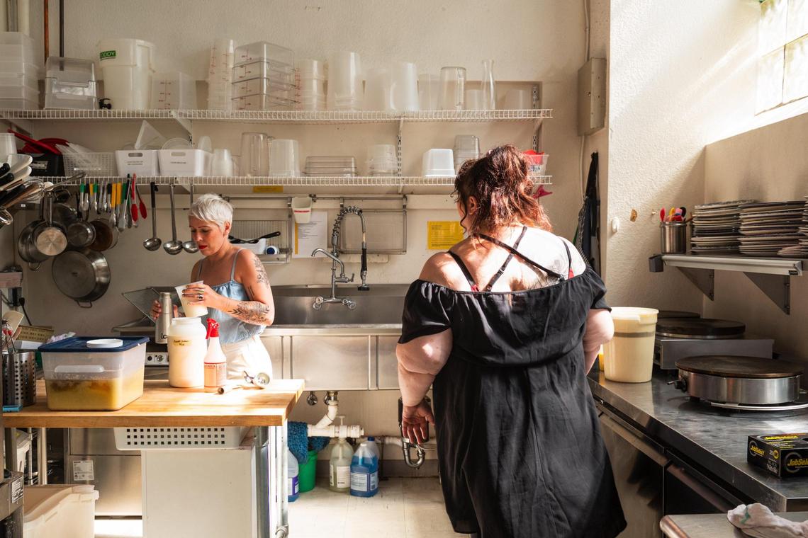 Beka Holman, left, and Lauren Snedden prepare a batch of whipped cream at Seven Swans Crêperie, which sources ingredients from local vendors.
