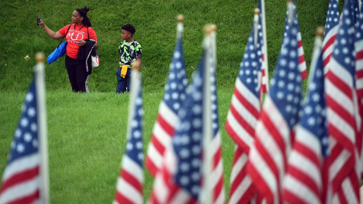 Visitors view Flags of the Forgotten Soldiers, a tribute to veterans lost to suicide, which were on display at the National World War I Museum and Memorial in Kansas City in this file photo. September is National Suicide Prevention Month.