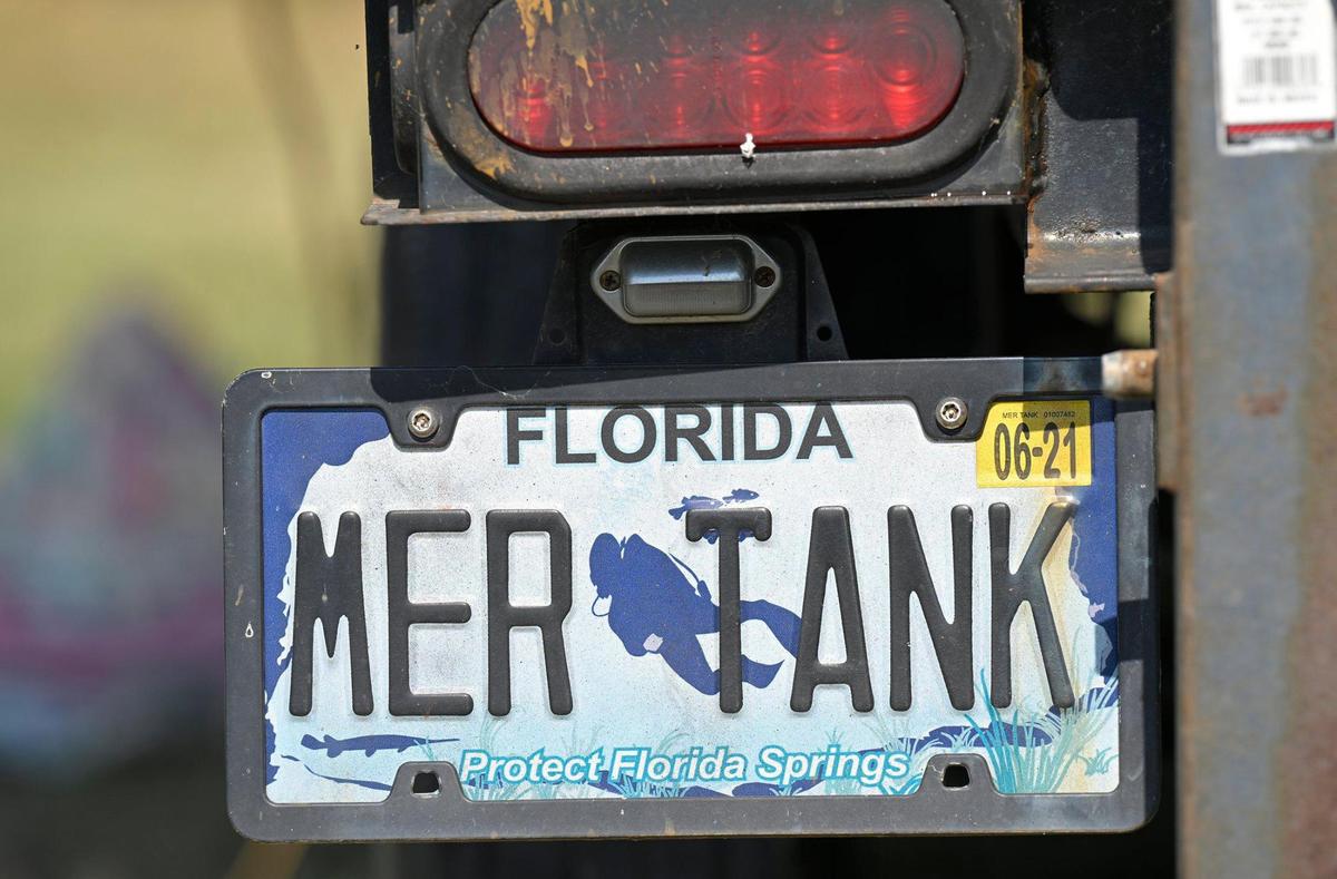A former sea turtle aquarium from a Florida zoo has been transformed into a portable mermaid tank, but still carries the former Mer Tank license plate.