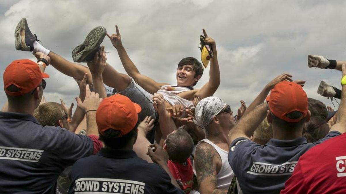 A concert enthusiast at Rockfest 2018 surfed the crowd during Red Sun Rising's performance on Saturday, June 2, 2018, at the Kansas Speedway in Kansas City, Kan.
