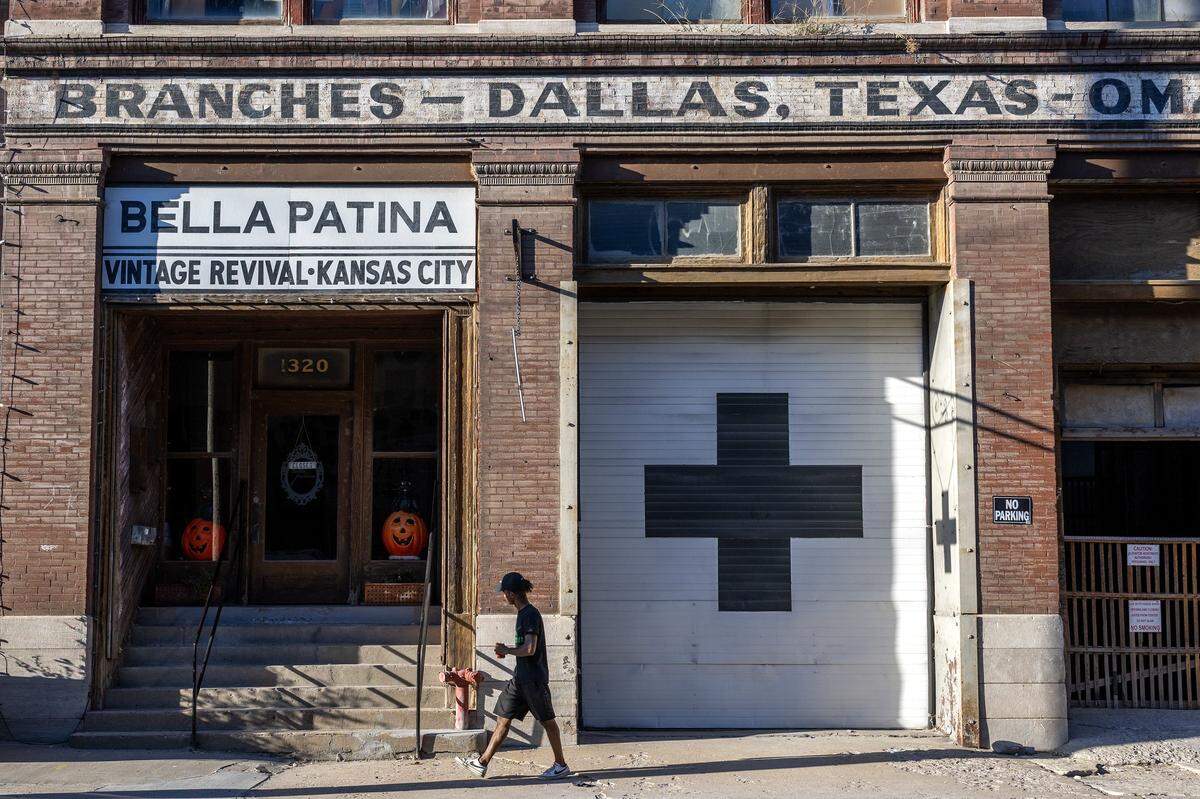 A pedestrian walks past Bella Patina at 1320 W 12th St., on Friday, Sept. 26, 2025, in Kansas City.