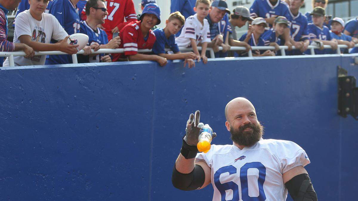 Buffalo Bills center Mitch Morse (60) takes the field for practice at NFL football training camp in Orchard Park, N.Y., on Saturday, July 31, 2021. (AP Photo/Joshua Bessex)