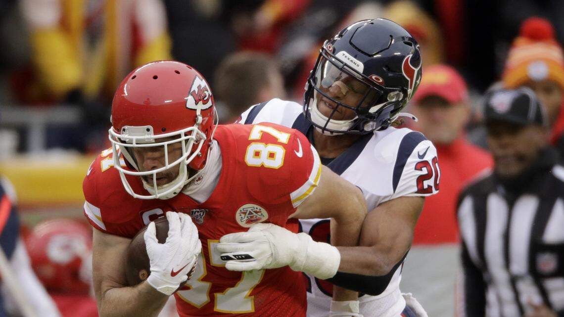 Safety Justin Reid, right, tackles Chiefs tight end Travis Kelce during a January 2020 playoff game between Houston and Kansas City at Arrowhead Stadium.