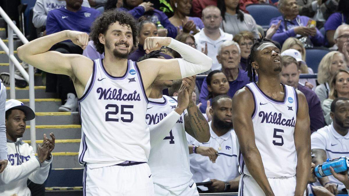 Kansas State’s Ismael Massoud, left, and Cam Carter react to their teammates increasing their lead against Montana State during the second half of their first round NCAA Tournament game in Greensboro, NC on Friday night.