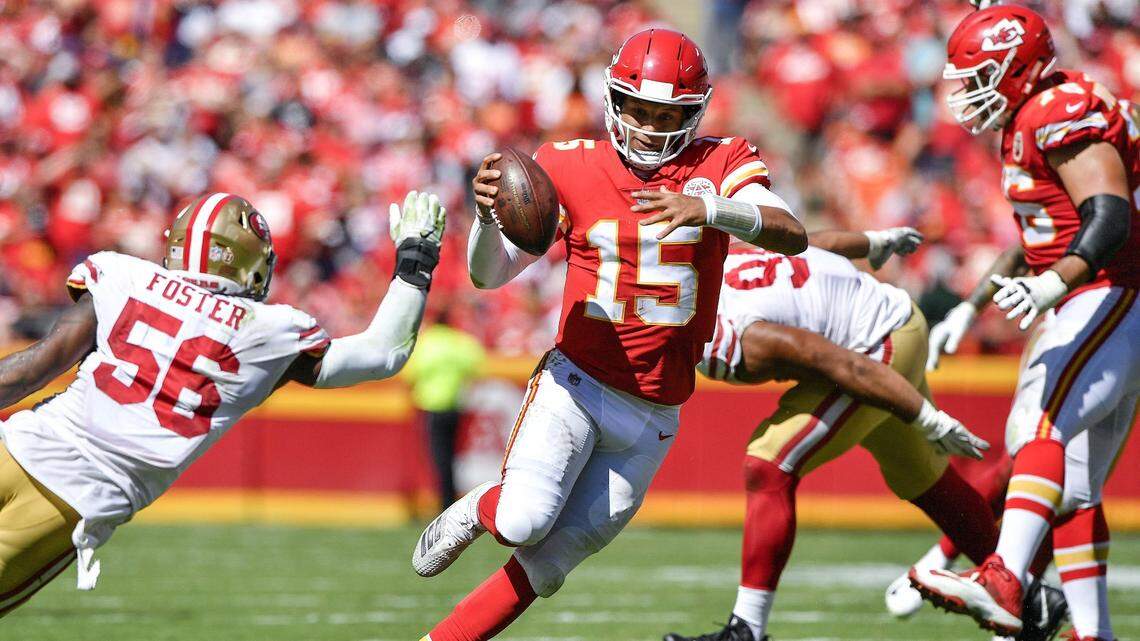 Kansas City Chiefs quarterback Patrick Mahomes scrambles around the San Francisco 49ers defense in the second quarter during Sunday’s football game on Sept. 23, 2018 at Arrowhead Stadium.