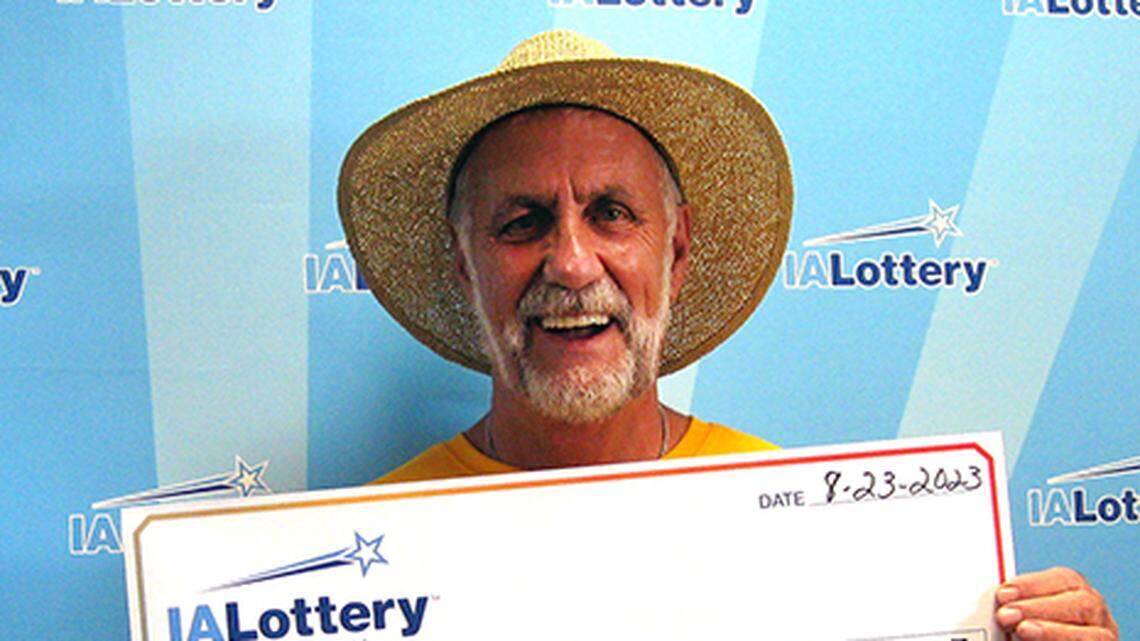 Marty Curry with his oversized check.