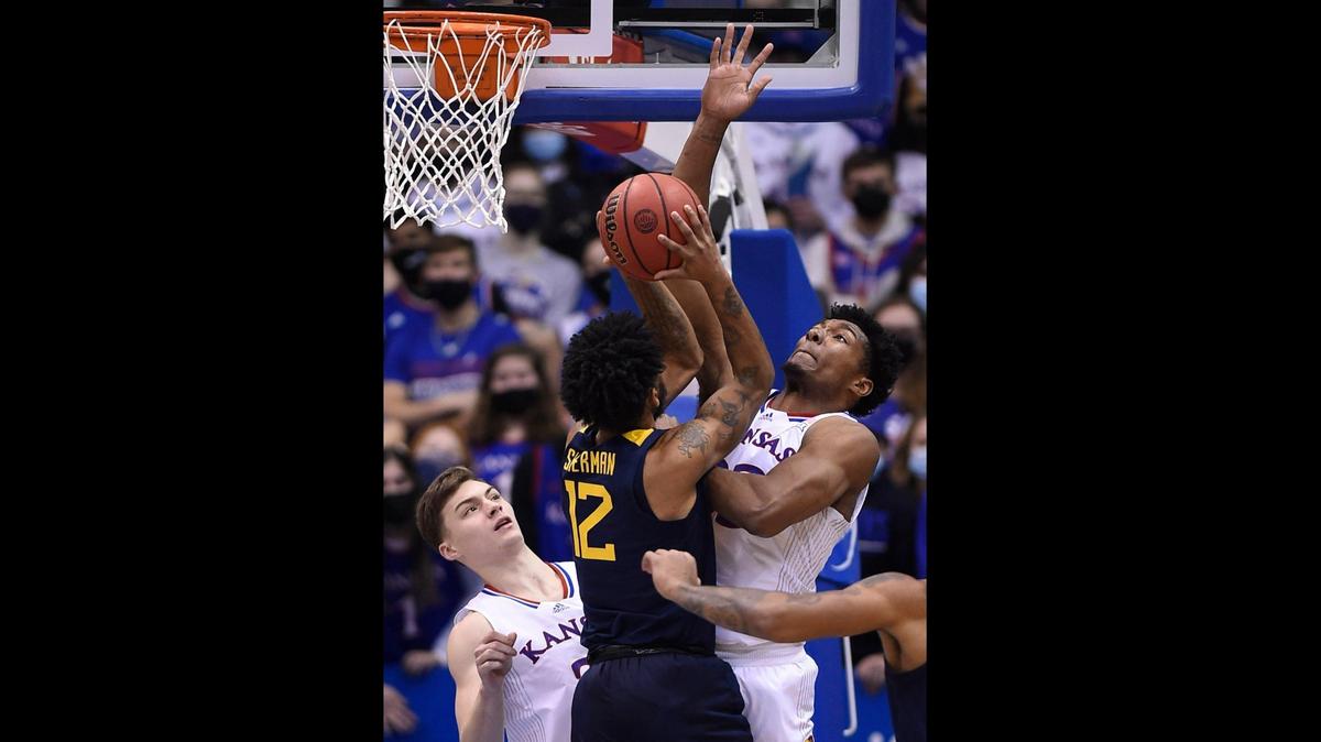 KU’s David McCormack defends West Virginia’s Taz Sherman during the first half of Saturday’s Big 12 game at Allen Fieldhouse. KU beat West Virginia, 85-59.