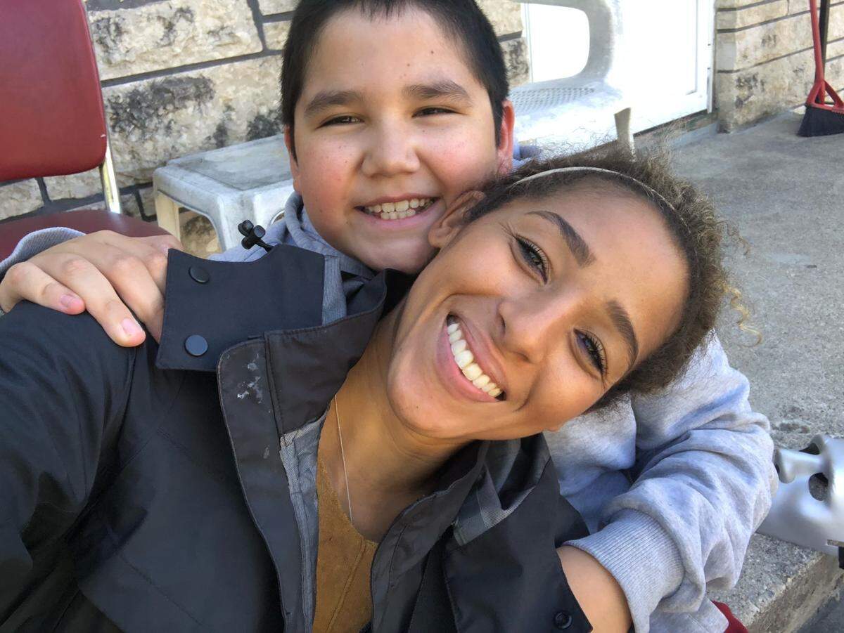 After nearly losing her foster brother, KC NWSL midfielder Desi Scott, front/bottom, made a move to make sure she’d never lose him again.