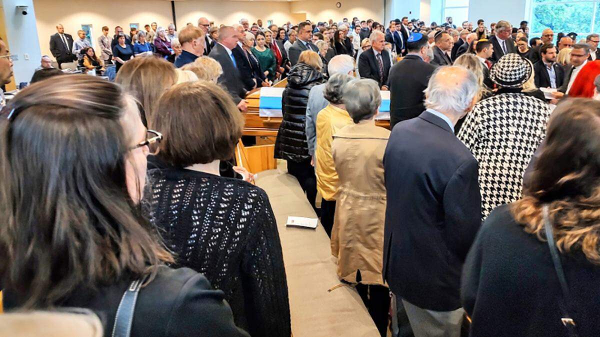 Attendees at Sarah Milgrim’s funeral in the sanctuary of Congregation Beth Torah in Overland Park.