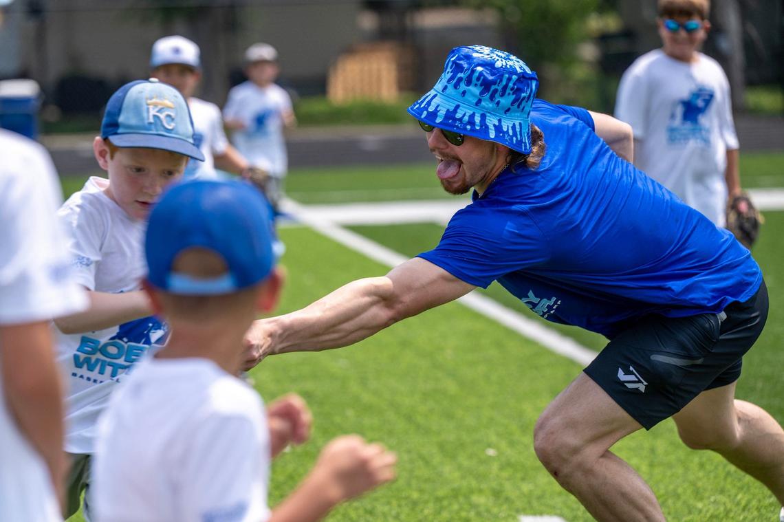 Kansas City Royals shortstop Bobby Witt Jr. tags out a participant while pitching to a group of kids during the Bobby Witt Jr. Youth Baseball ProCamp at Bishop Miege High School on Thursday, July 25, 2024, in Roeland Park, Kansas.