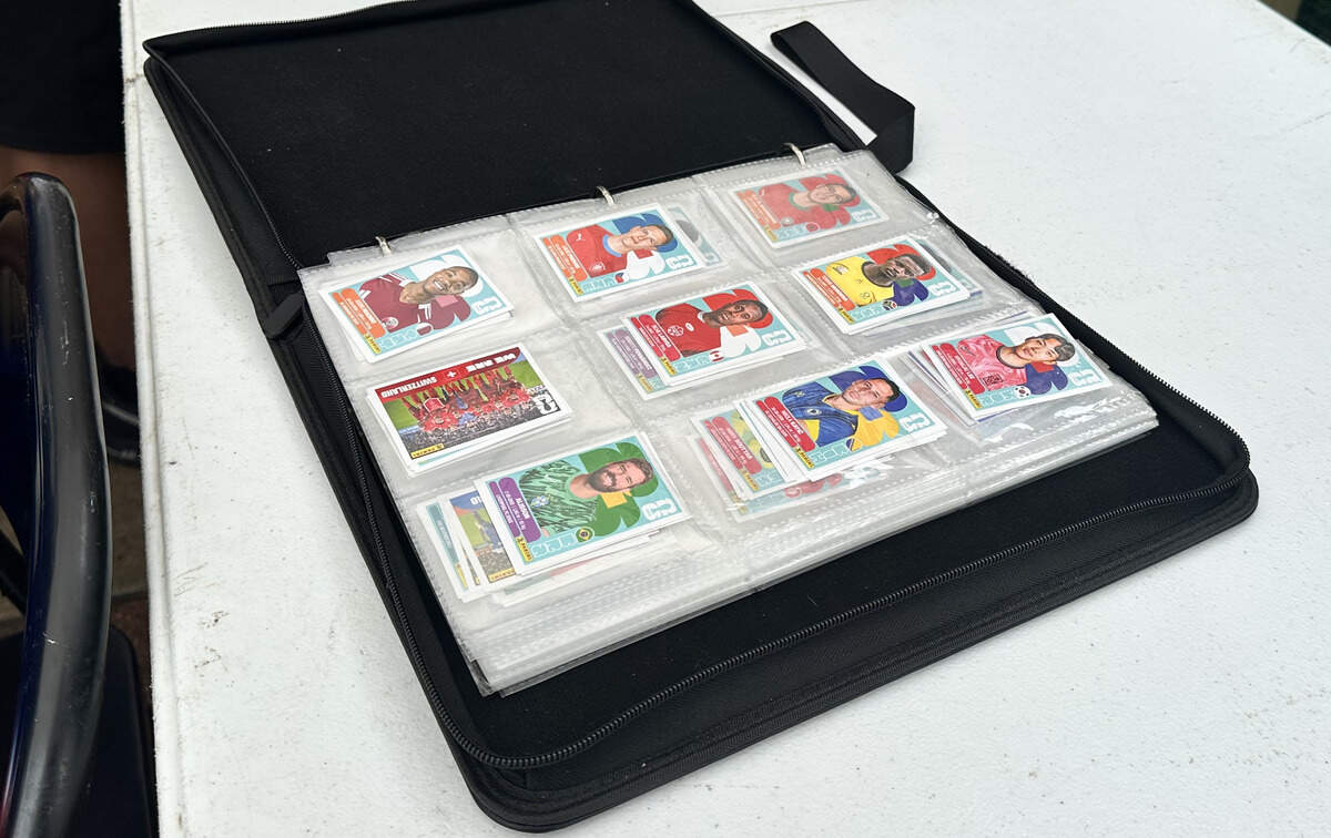 The owners of Panaderia de Las Americas have an extra binder where they store all of their duplicates. Collectors do this to make it easier for others to find the card they might need.