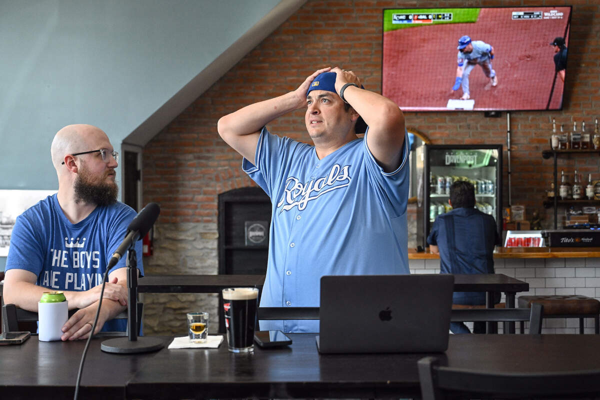 Joel Penfield, left of Basehor, Kansas,&nbsp;and Josh Keiser of Kansas City watch the Kansas City Royals play the Baltimore Orioles in the AL Wild Card game Tuesday at The Davenport, a sports bar in Kansas City, Kansas.&nbsp;