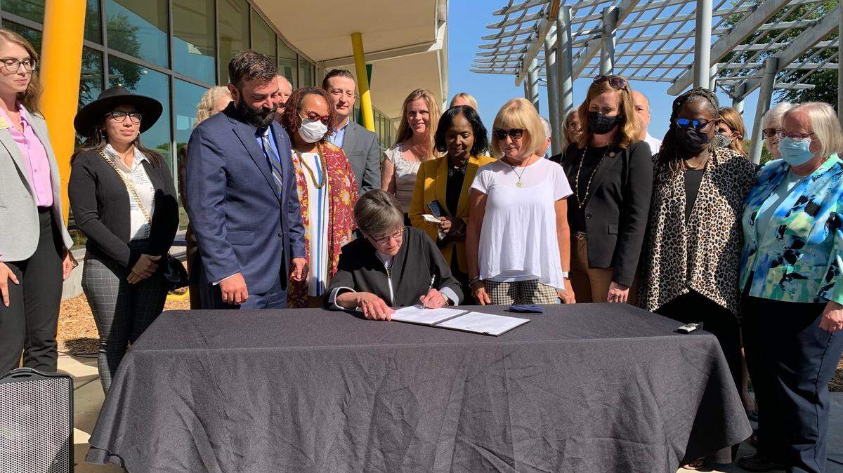 Gov. Laura Kelly signed an executive order Monday establishing an office of the child advocate in Kansas.