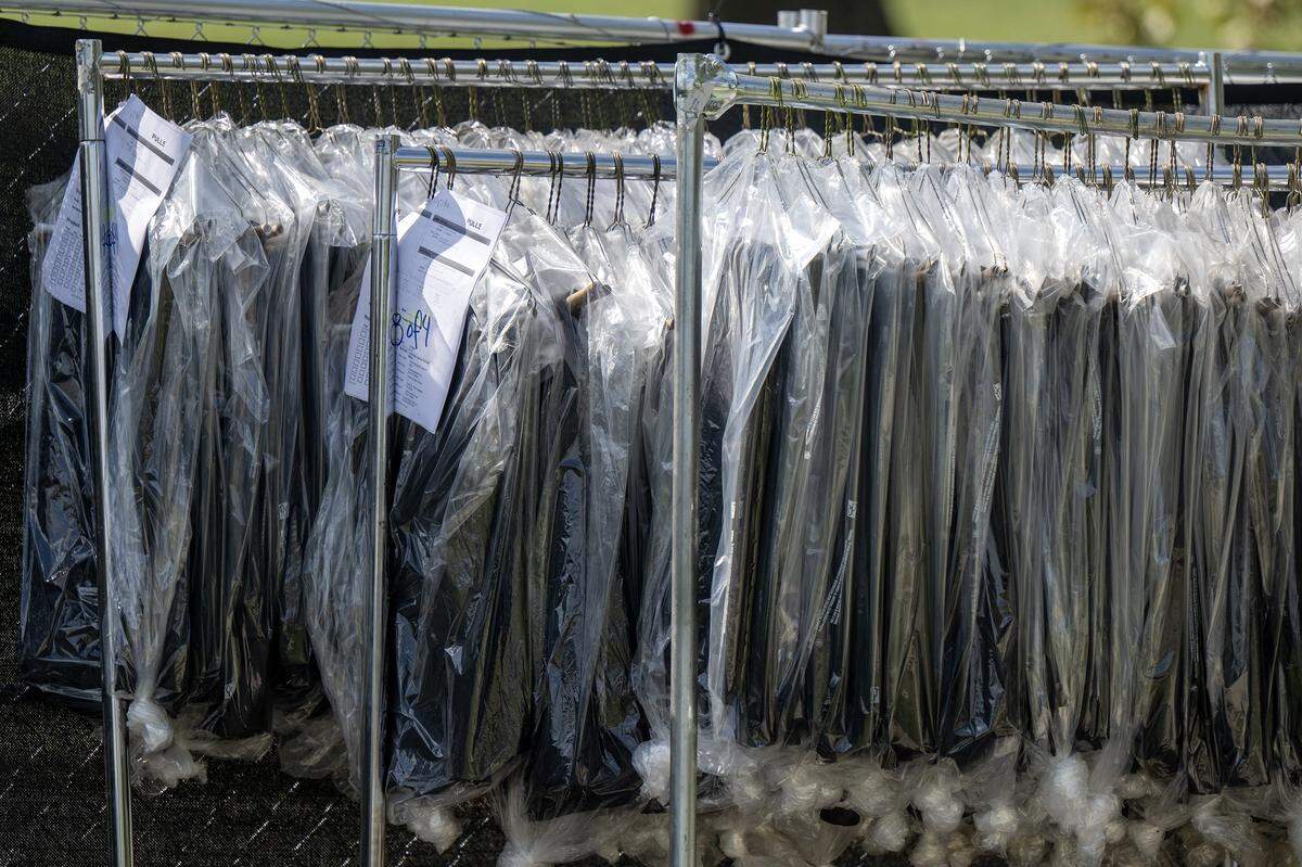 Racks of clothing is seen outside the National WWI Museum and Memorial on Wednesday, Oct. 1, 2025, in Kansas City, ahead of pop singer Chappell Roan's concert Visions of Damsels and Other Dangerous Things.