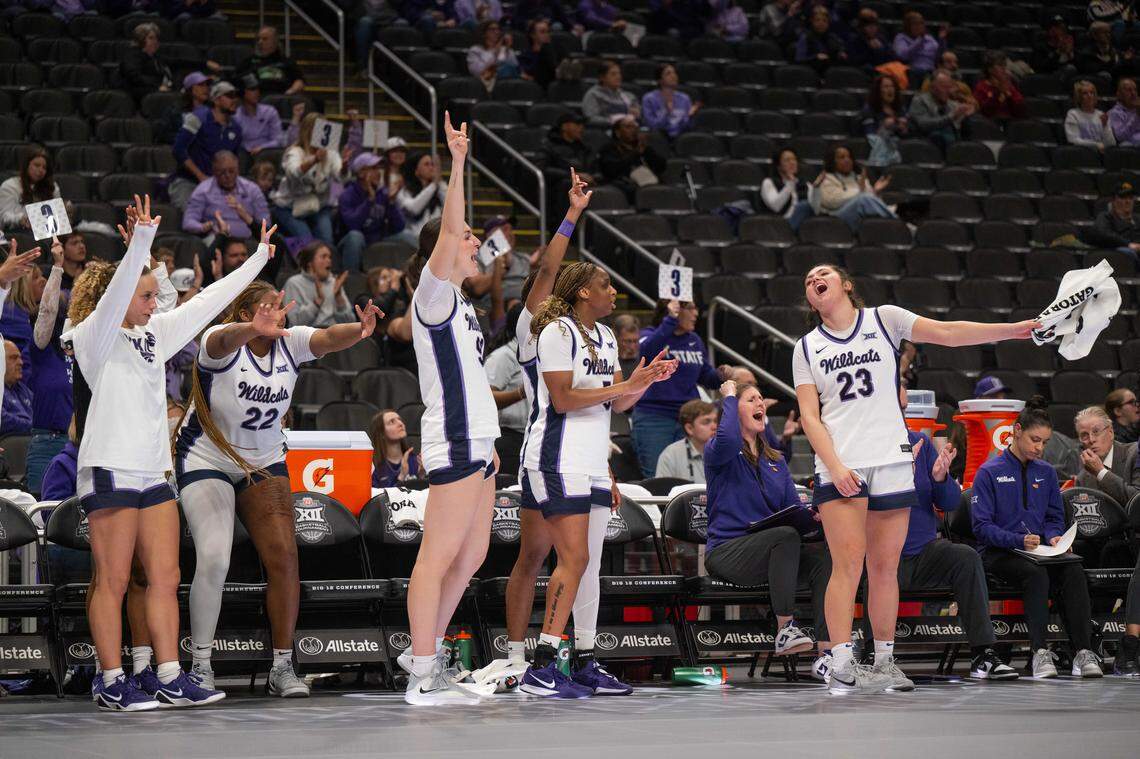 Players on the Kansas State Wildcats’ bench celebrate a 3-pointer during the second half of the team’s first-round game vs. the Cincinnati Bearcats.