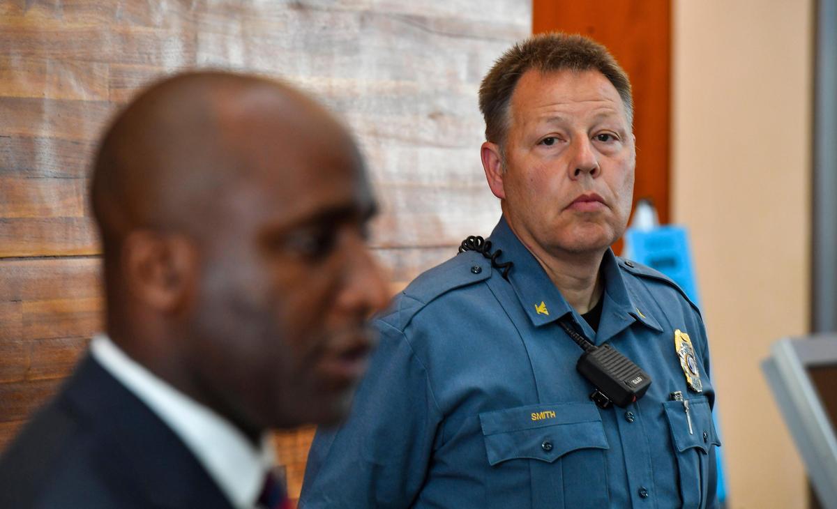 During a news conference Tuesday just a short distance away from the George Floyd protest on the Country Club Plaza, Kansas City police chief Rick Smith, right, watched while Kansas City mayor Quinton Lucas noted that videos on social media have shown what protesters have described as excessive force. The mayor said he spoke Tuesday with the FBI agent in charge in the region who is willing to review any allegations of misconduct.