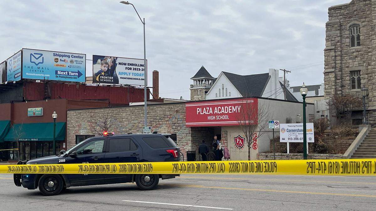 Police tape closes off an area near the Plaza Academy High School. Kansas City police say a shooting took place nearby that left one person with non-life-threatening injuries.