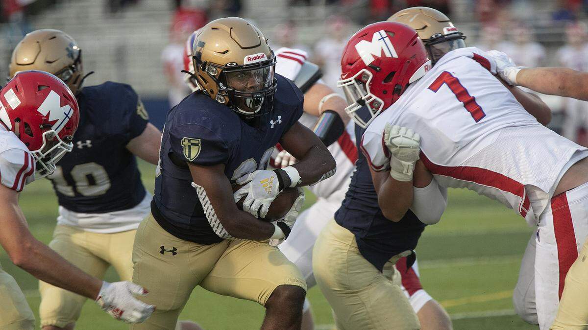 Tyron Young, #28 of Aquinas carried the ball during the game against Bishop Miege Friday, September 18, 2020.