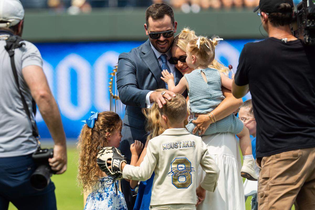 Mike “Moose” Moustakas hugs his family after giving his retirement speech on Saturday, May 31, 2025 at Kauffman Stadium. Moustakas officially retired as a Royal after a 12-year career in Major League Baseball.