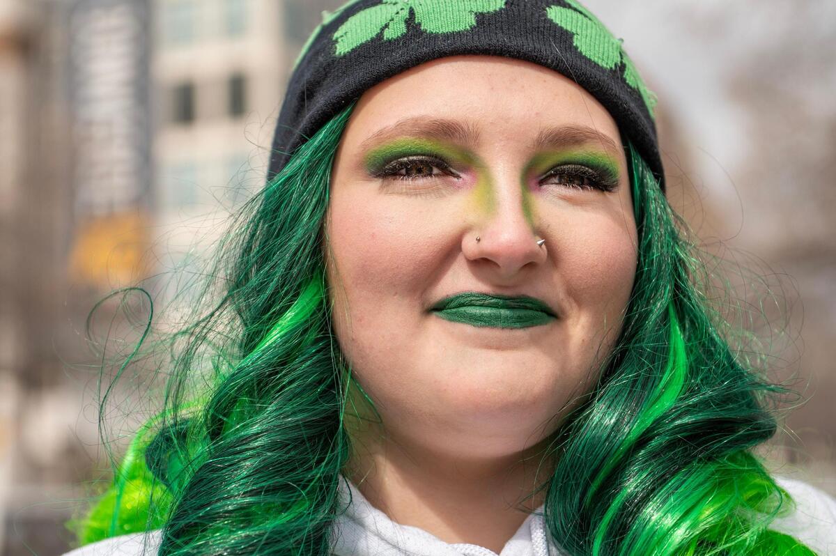 Dakota Dady sports green eye shadow and lipstick during the Kansas City St. Patrick’s Day parade on Friday, March 17, 2023, in Kansas City.