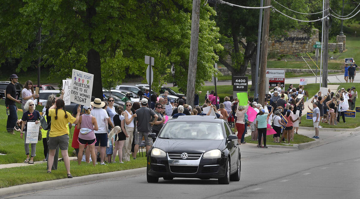 In response to the Supreme Court overturning Roe v. Wade, the Johnson County Democratic Party and Kansas Democrats hosted a demonstration Sunday in Johnson County near College Blvd. and Roe Ave., to demand defense of reproductive freedoms in Kansas. Participants called on Republican candidate Amanda Adkins to stand up for a person’s right to choose and defend reproductive freedoms. The decision overturned 50 years of precedent and allows states to restrict access to essential health care.
